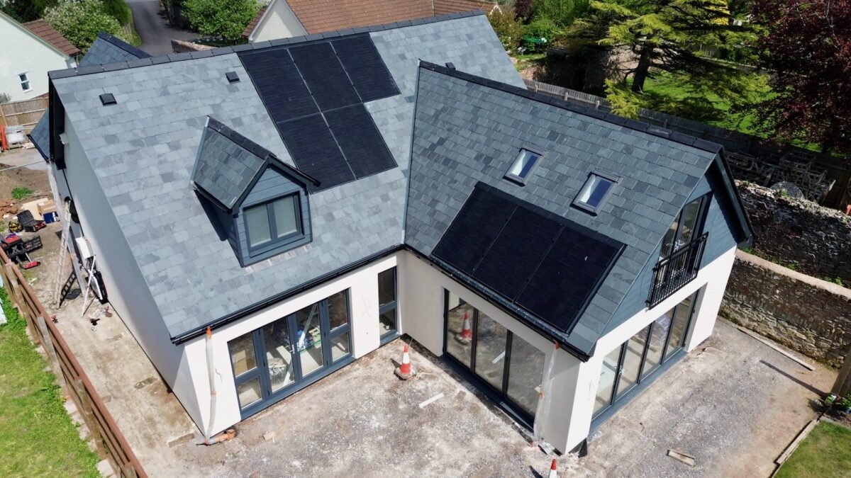 An aerial photo of solar panels on a house