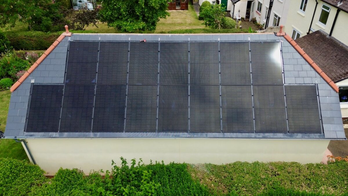 An aerial photo of solar panels on an outbuilding