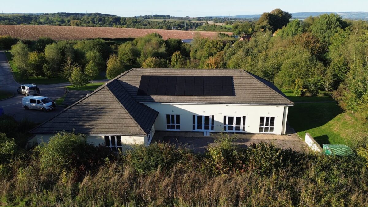 An aerial photo of solar panels on a house