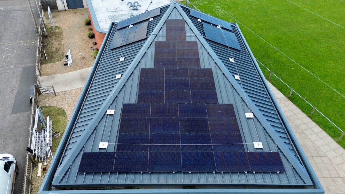 An aerial photo of solar panels on a house